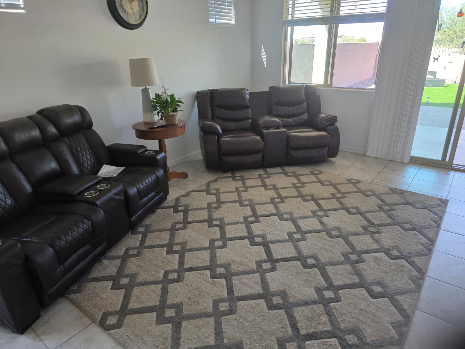 Bright shared living room with a sofa, coffee table and natural light