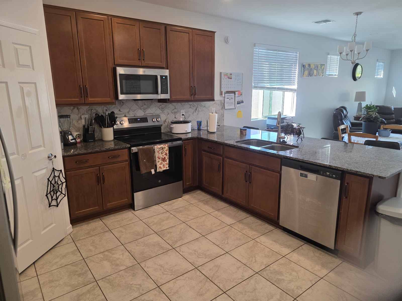 A warm residential kitchen and dining table set for everyday meals